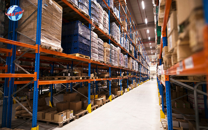 Aisles of tall shelving racks filled with inventory in a warehouse
